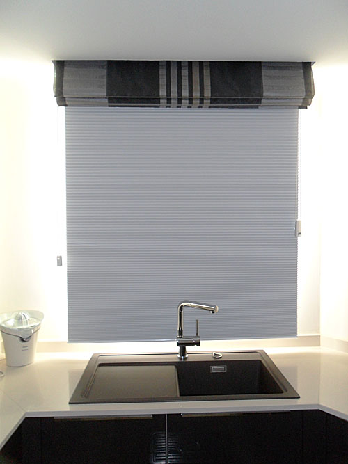 Roman blind in front of plissé shade